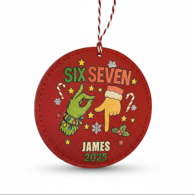 Red Christmas ornament with festive design and text on a white background