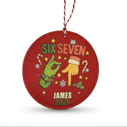 Red Christmas ornament with festive design and text on a white background