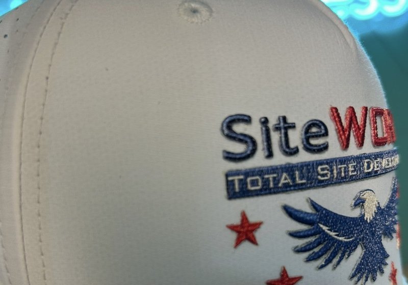 SiteWORX rope cap with a SolidCore Embroidery™ front design: an eagle and red stars above the company name