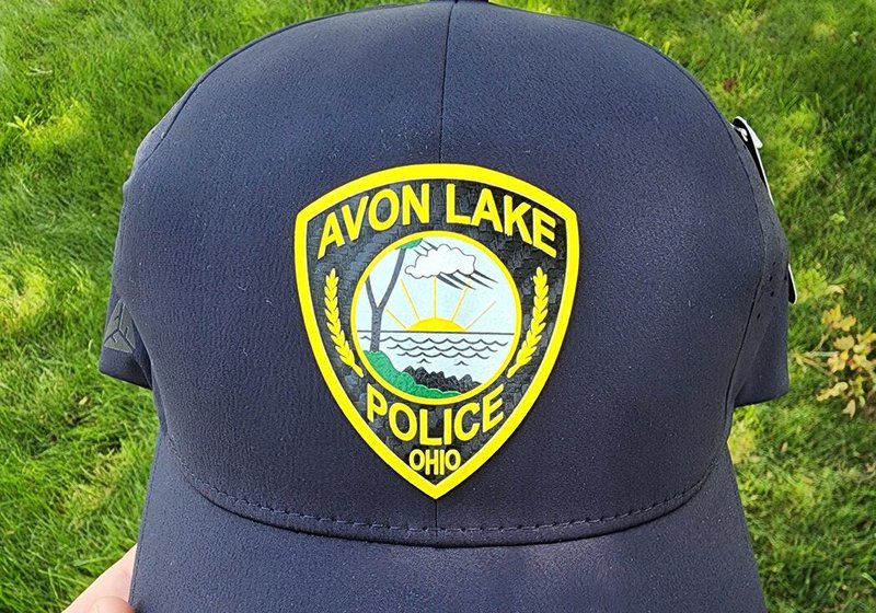 Navy Avon Lake Police cap with a raised, dimensional Ohio police badge in yellow, blue and white